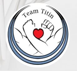 Image is of the Team Titin logo, two forearms interlinked with fists up and a heart in between.